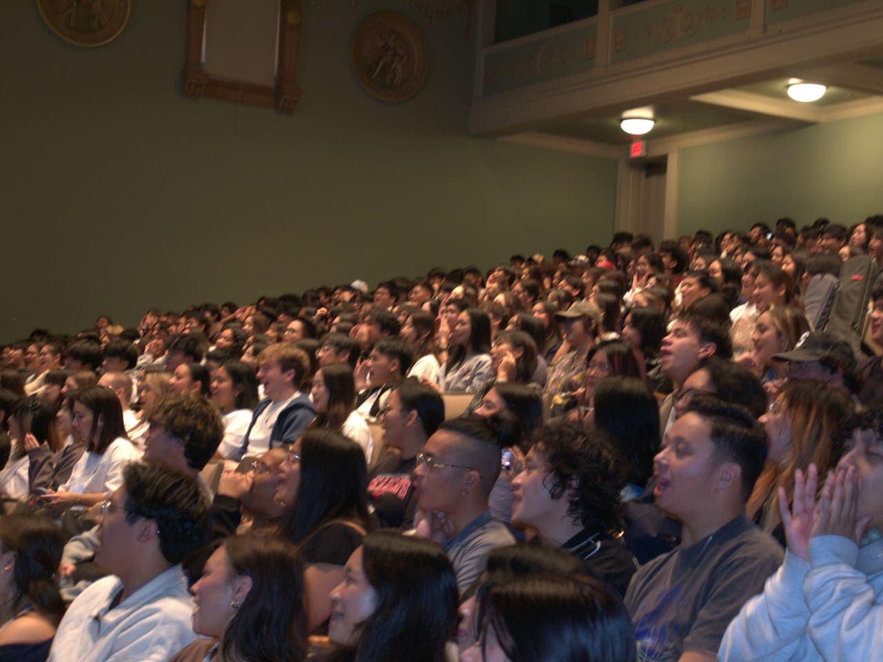 A full auditorium of delegates during a FACT session