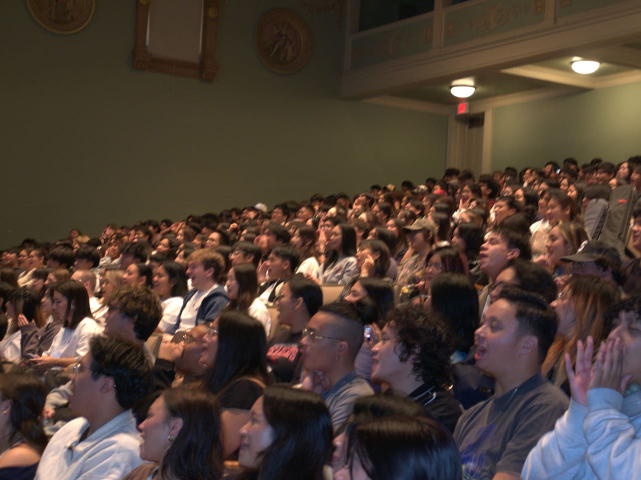 A full auditorium of delegates during a FACT session