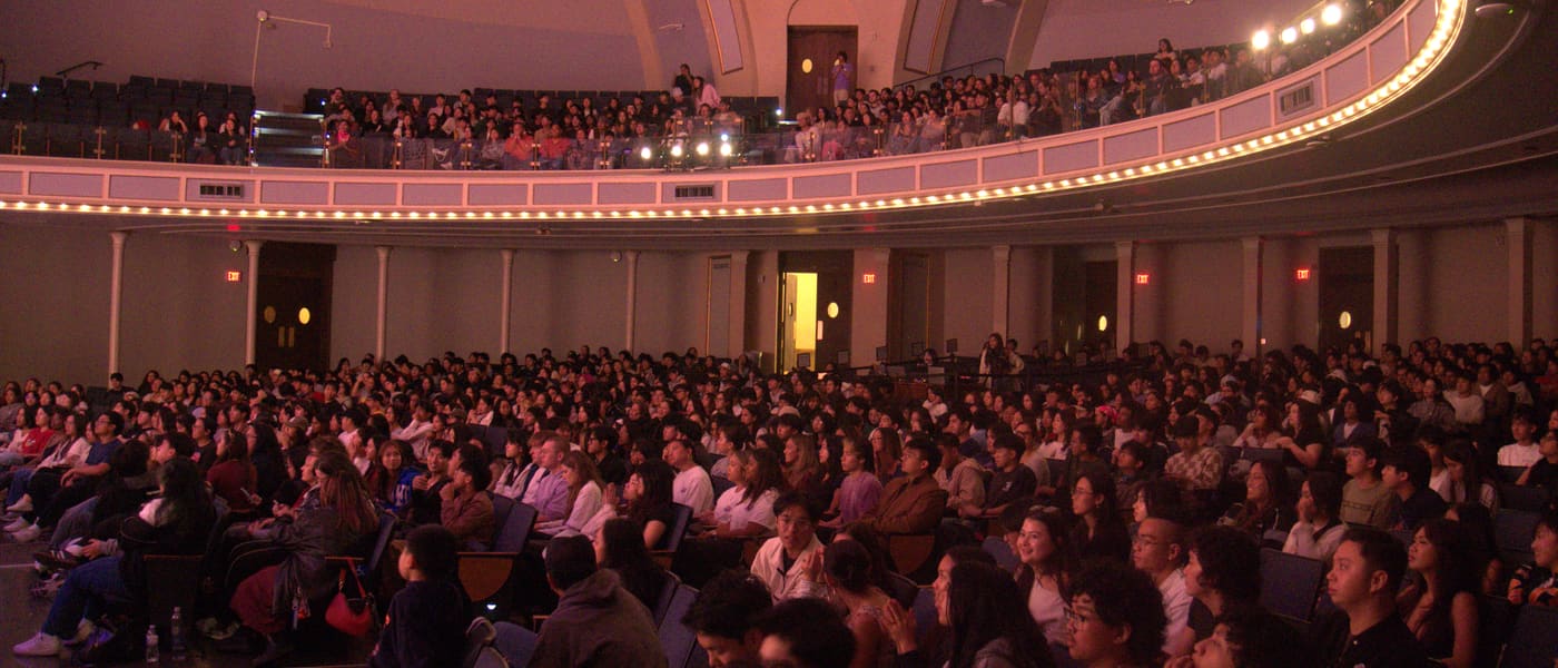 A packed auditorium of FACT delegates during a conference session